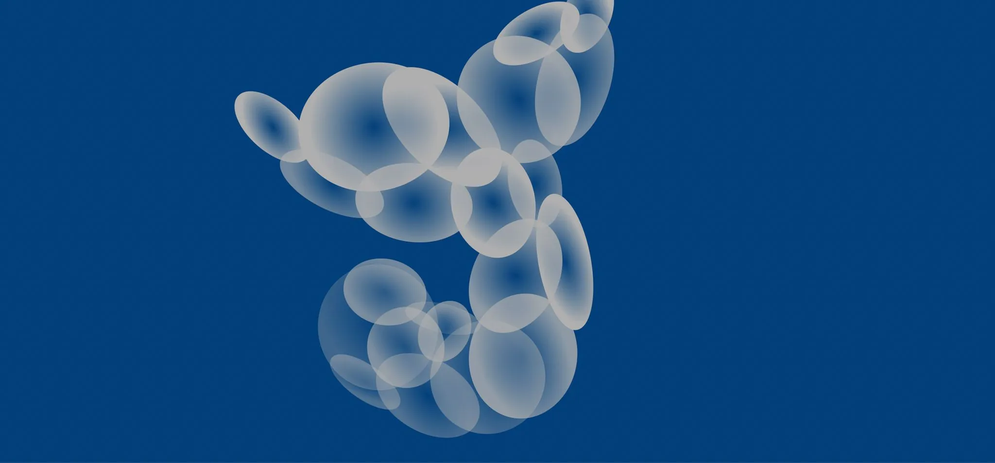 Imagem de bolhas cinzas formando a silhueta de uma baleia. O fundo da imagem é um azul sólido.